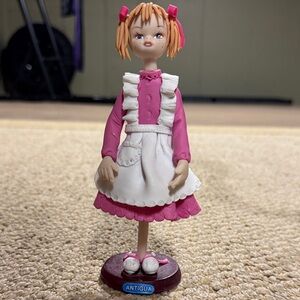 Pink and White Doll Figurine